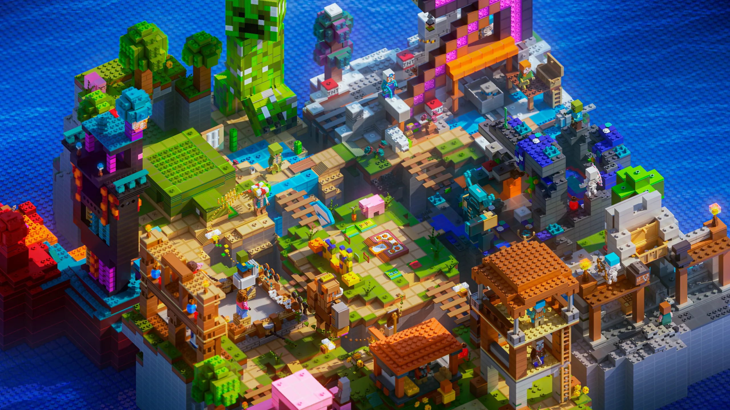 Minecraft island build packed with colorful towers, bridges, and small houses on rocky terrain, surrounded by bright blue water and vivid green, pink, orange, and purple details.