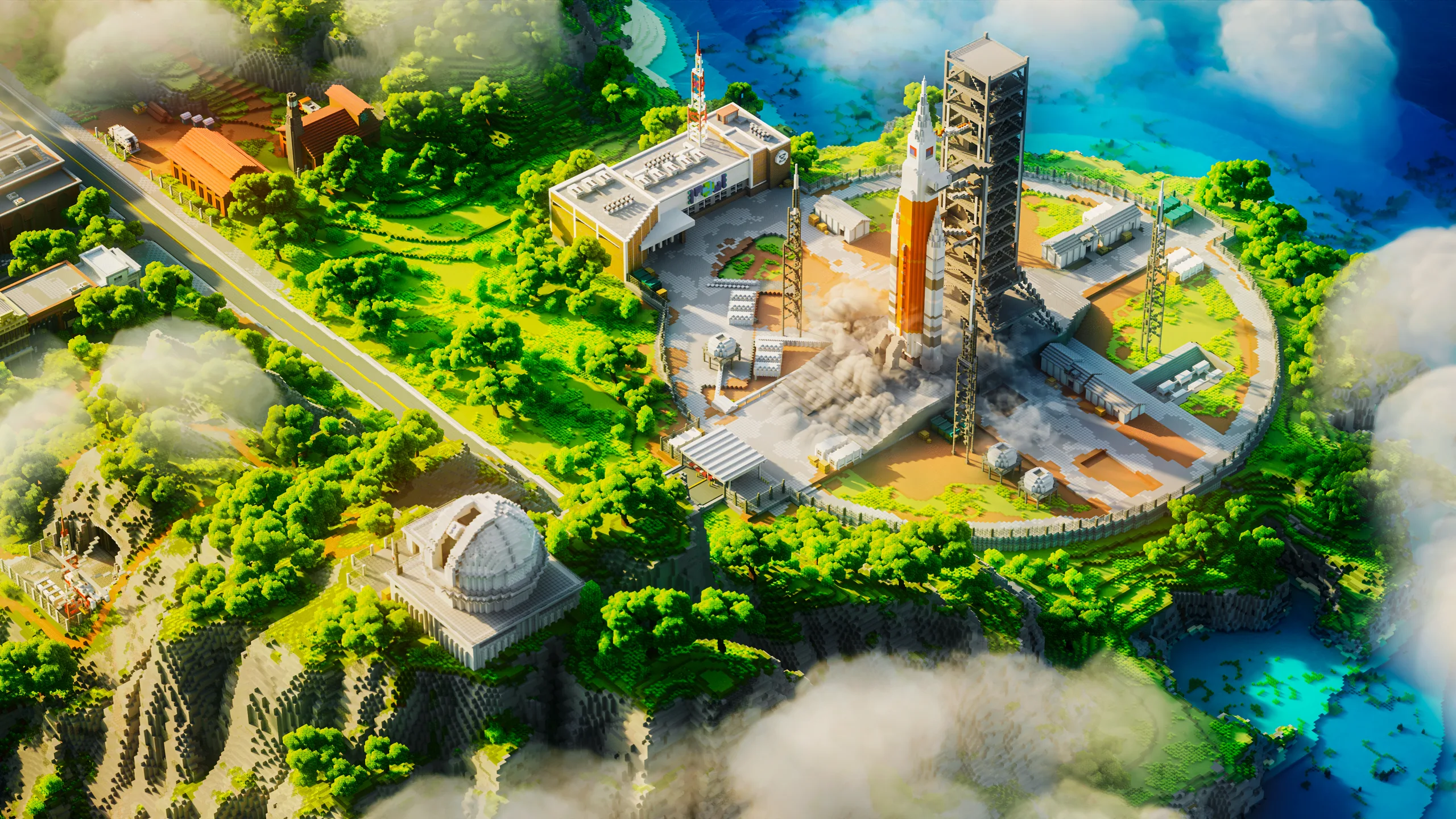 Minecraft coastal base with a large circular rocket launch pad, tall tower, and white industrial buildings beside turquoise water. Green hills, a winding road, and clouds frame the scene.