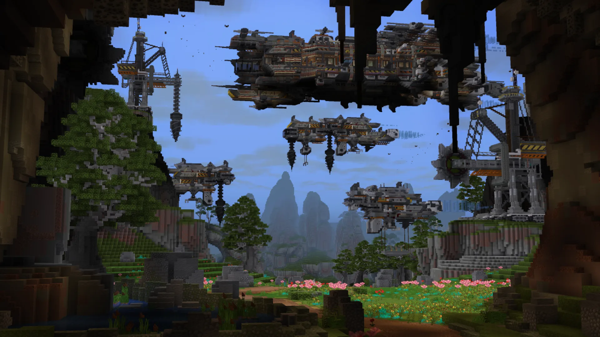 Minecraft scene of a cave opening onto a valley with floating industrial platforms, cranes, and hanging structures above trees, flowers, and distant mountains.