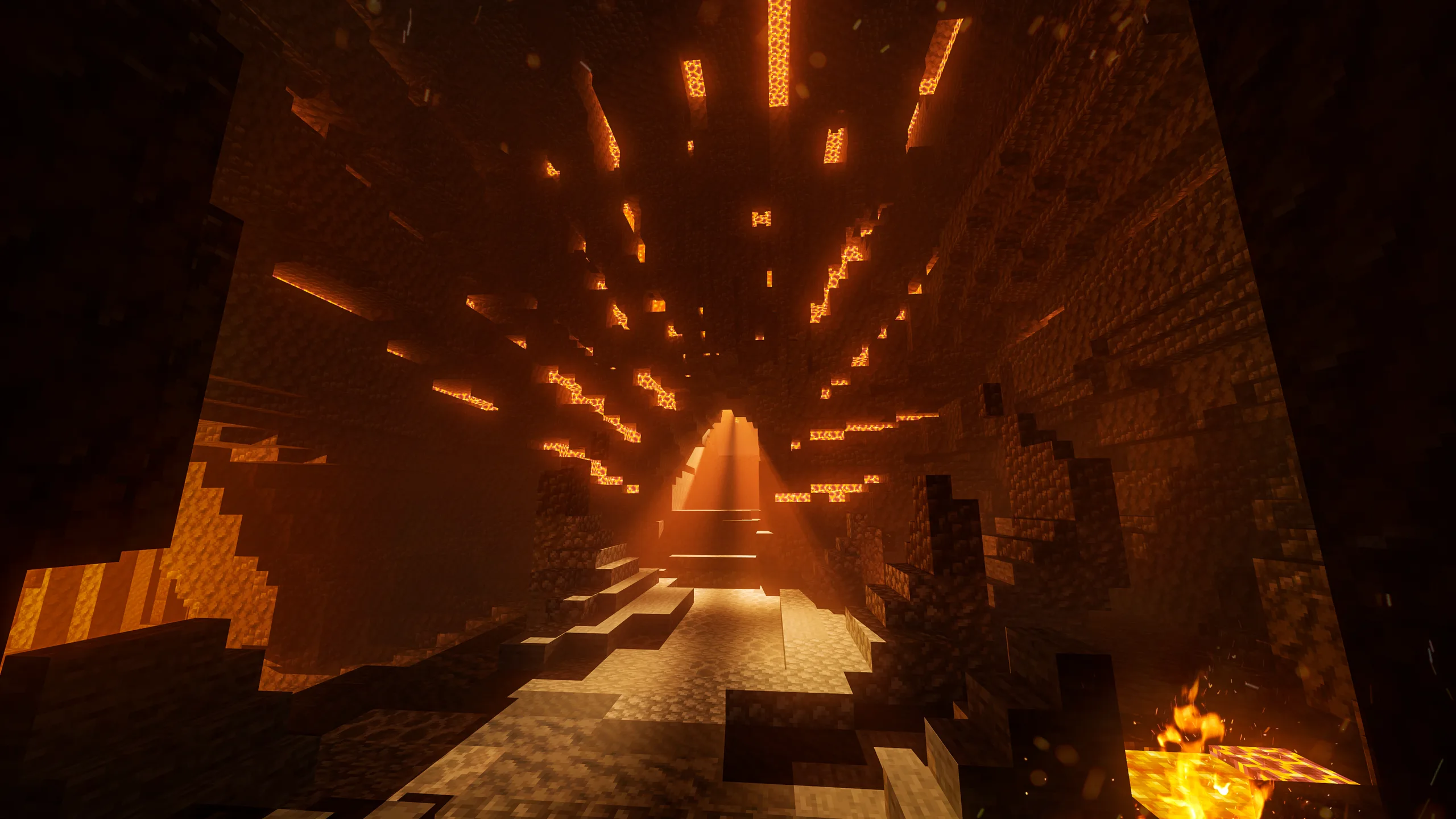 Minecraft cavern glowing with orange light, a stepped path leading toward a bright opening, with dark rock walls and ceiling speckled by hanging light strips.