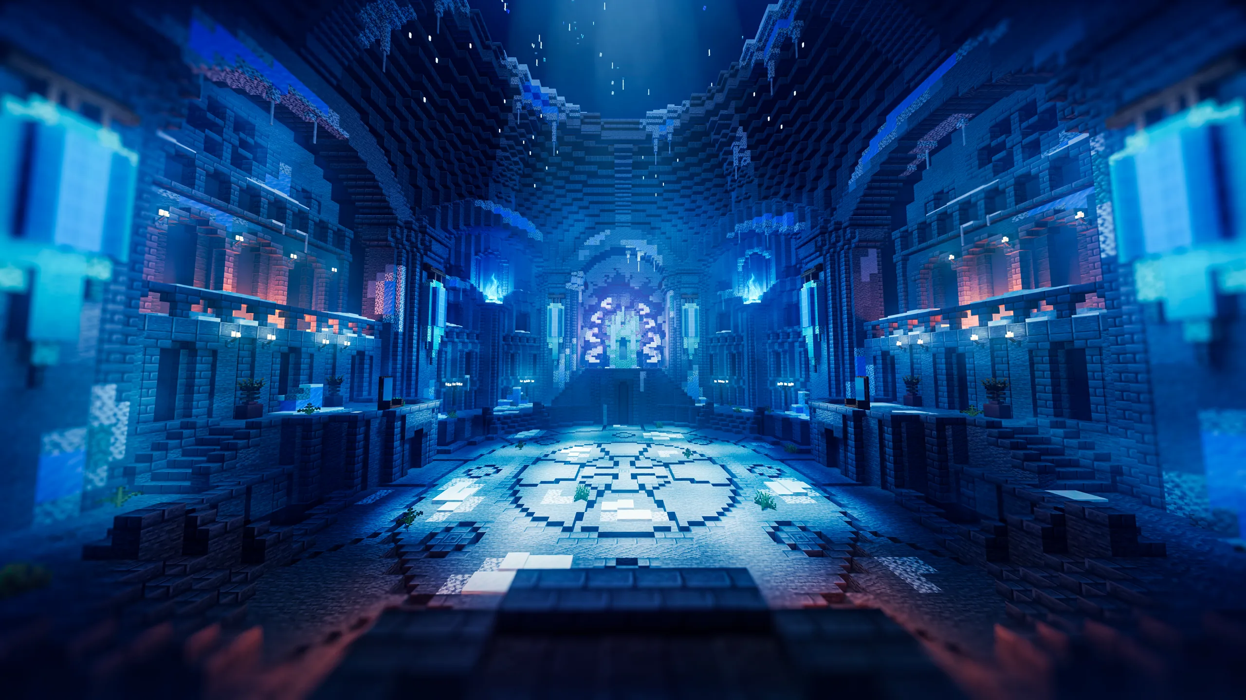 Minecraft build of a विशाल blue stone hall with tall symmetrical walls, glowing pillars, and a patterned circular floor, viewed from a centered aisle under a dark vaulted ceiling.